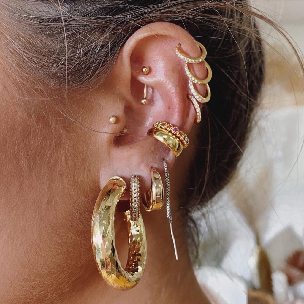 girl wearing golden hoops