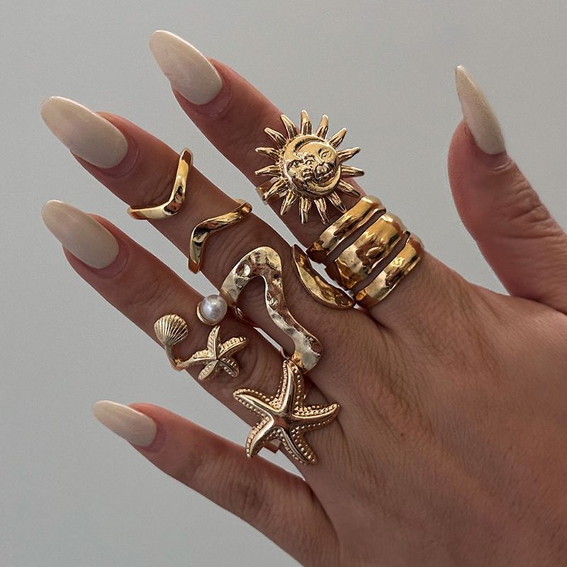 girl wearing golden rings