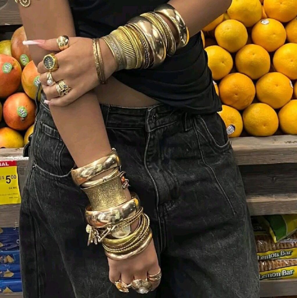 girl wearing so many golden bangles